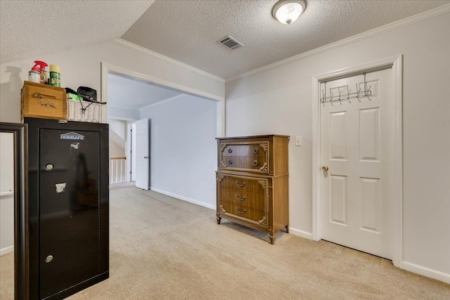 corridor featuring visible vents, a textured ceiling, carpet floors, crown molding, and lofted ceiling