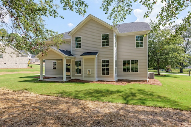 back of property featuring a patio, cooling unit, and a lawn