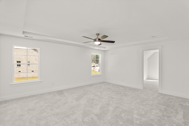 empty room featuring light carpet and ceiling fan