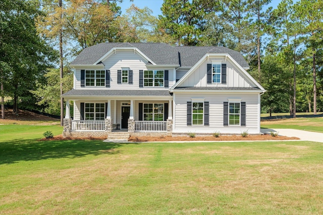 craftsman-style house featuring a porch and a front lawn