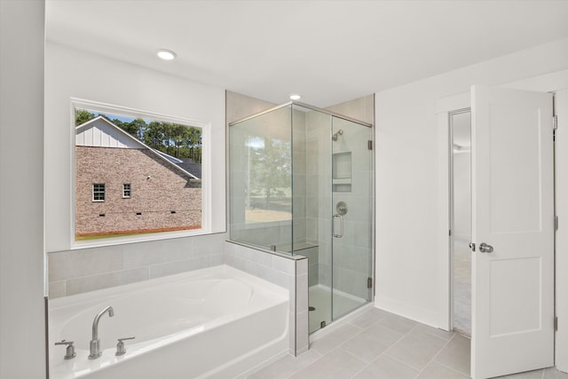 bathroom with tile patterned flooring and plus walk in shower