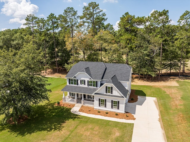 view of front facade with a front lawn and a porch