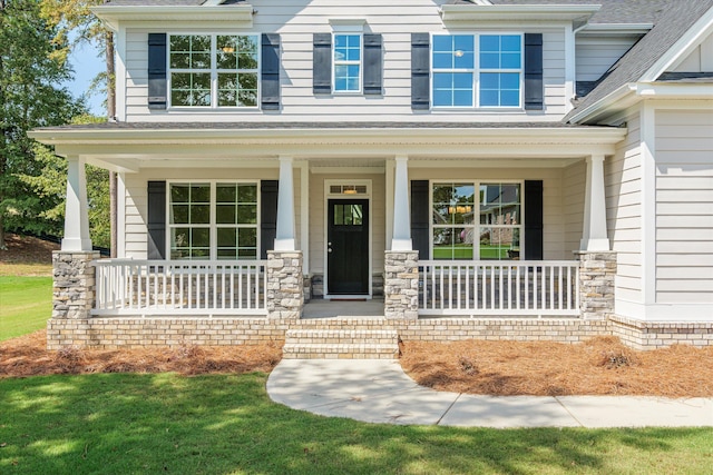 doorway to property with covered porch