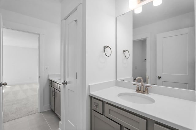 bathroom with tile patterned flooring and vanity