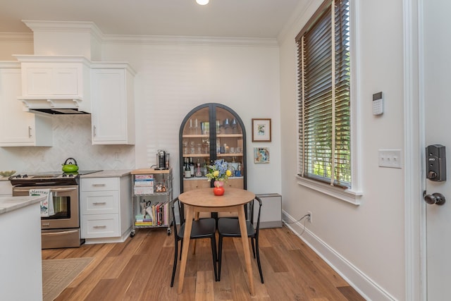 450 Railroad Ave Unit 4B, North Augusta, SC 29841 - dining space featuring baseboards, ornamental molding, and light wood-style flooring