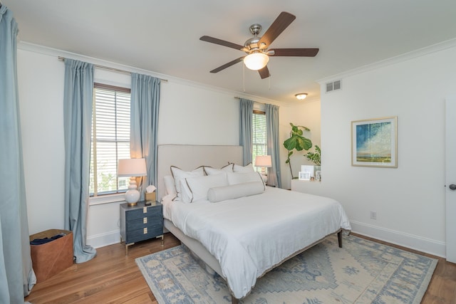 450 Railroad Ave Unit 4B, North Augusta, SC 29841 - bedroom featuring baseboards, visible vents, wood finished floors, ceiling fan, and crown molding