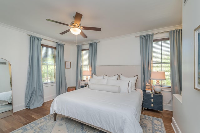 450 Railroad Ave Unit 4B, North Augusta, SC 29841 - bedroom featuring ceiling fan, baseboards, ornamental molding, and wood finished floors