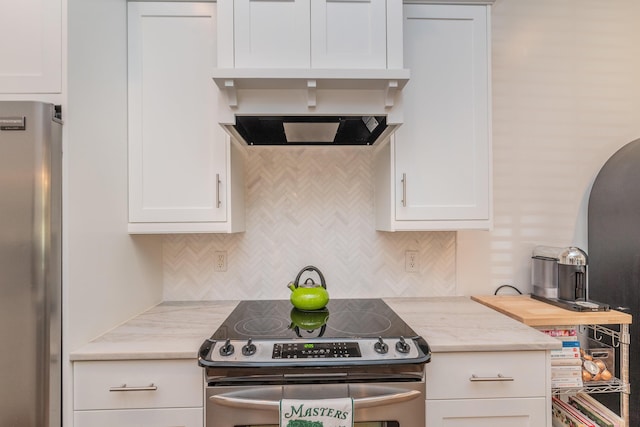 450 Railroad Ave Unit 4B, North Augusta, SC 29841 - kitchen featuring decorative backsplash, white cabinetry, and stainless steel appliances