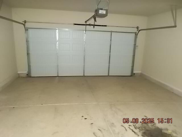 321 Firelight Dr, Grovetown, GA 30813 - garage with a garage door opener and baseboards