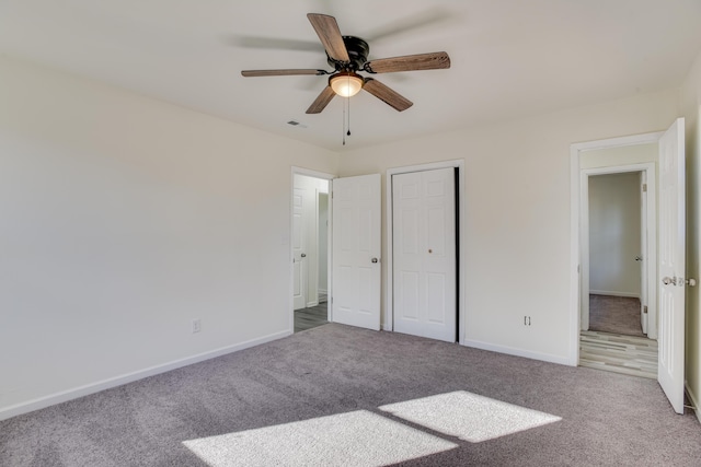 unfurnished bedroom with ceiling fan and carpet floors