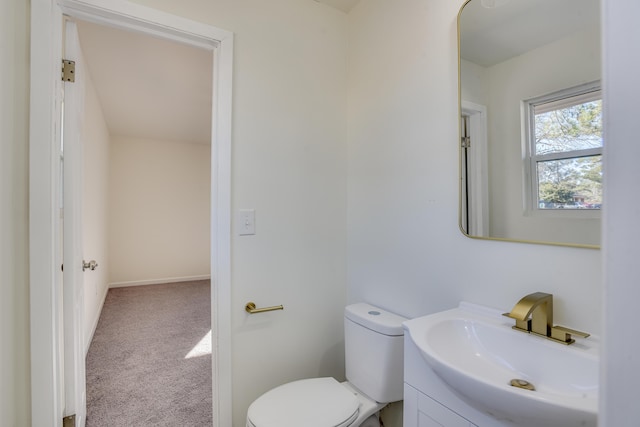 bathroom with toilet and vanity