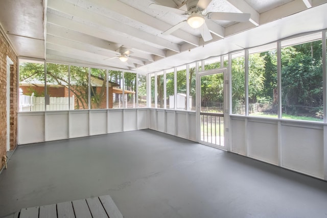 unfurnished sunroom with ceiling fan