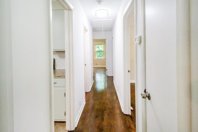 hallway with dark wood-type flooring