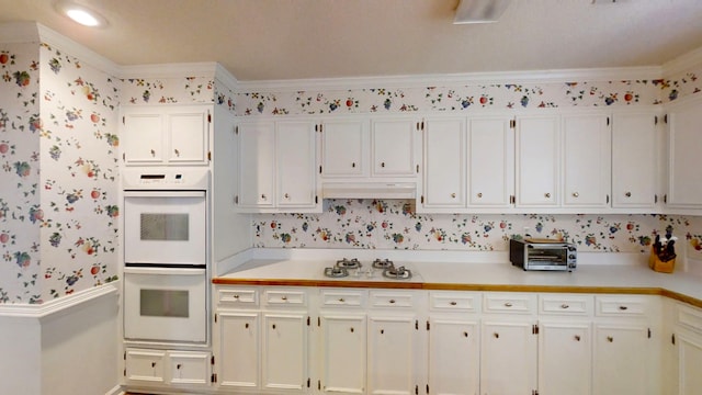 3018 Hillcreek Dr, Augusta, GA 30909 - kitchen with white appliances, light countertops, white cabinets, wallpapered walls, and baseboards