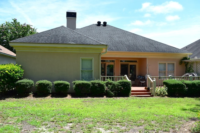 3018 Hillcreek Dr, Augusta, GA 30909 - rear view of house with roof with shingles, a yard, stucco siding, a chimney, and a wooden deck