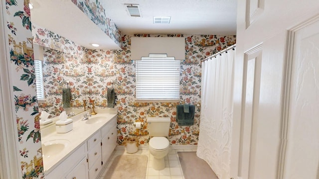 3018 Hillcreek Dr, Augusta, GA 30909 - full bathroom with wallpapered walls, double vanity, toilet, tile patterned flooring, and baseboards