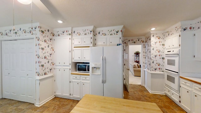 3018 Hillcreek Dr, Augusta, GA 30909 - kitchen featuring white appliances, wallpapered walls, white cabinetry, ceiling fan, and light countertops