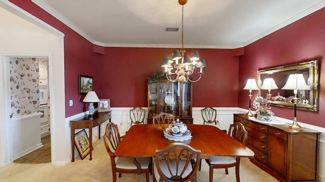3018 Hillcreek Dr, Augusta, GA 30909 - dining area featuring a wainscoted wall, a chandelier, light colored carpet, and ornamental molding