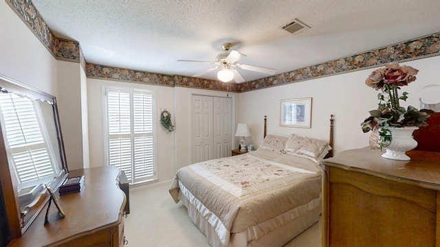 3018 Hillcreek Dr, Augusta, GA 30909 - bedroom featuring multiple windows, light carpet, ceiling fan, a closet, and a textured ceiling