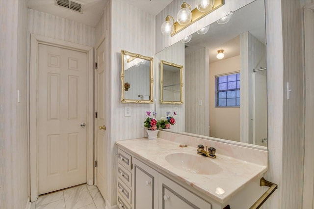 bathroom featuring visible vents, marble finish floor, and vanity