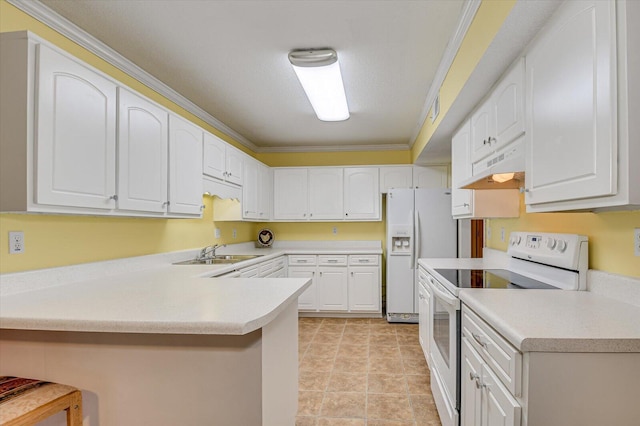 kitchen with ornamental molding, under cabinet range hood, a sink, white appliances, and a peninsula