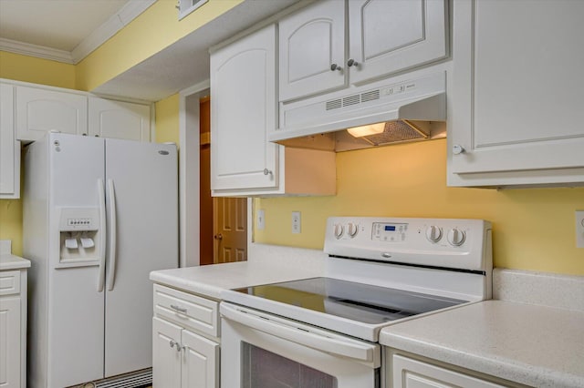 kitchen featuring white appliances, white cabinets, crown molding, and under cabinet range hood