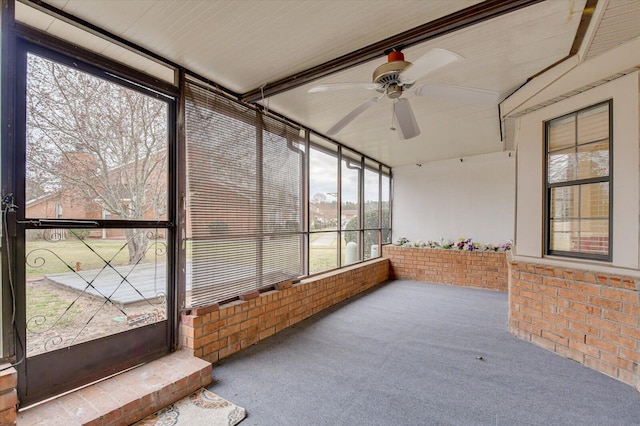 sunroom with a ceiling fan