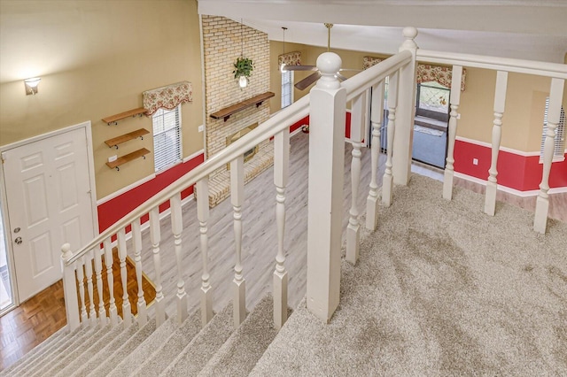 staircase with high vaulted ceiling