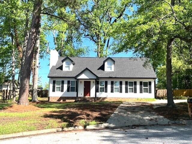 141 Glenora Dr, Martinez, GA 30907 - new england style home with a front yard, fence, and a chimney