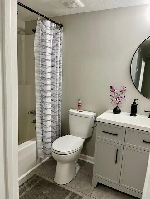 141 Glenora Dr, Martinez, GA 30907 - bathroom featuring vanity, visible vents, toilet, shower / tub combo, and tile patterned floors