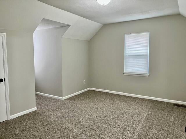 141 Glenora Dr, Martinez, GA 30907 - bonus room featuring baseboards, vaulted ceiling, and carpet floors