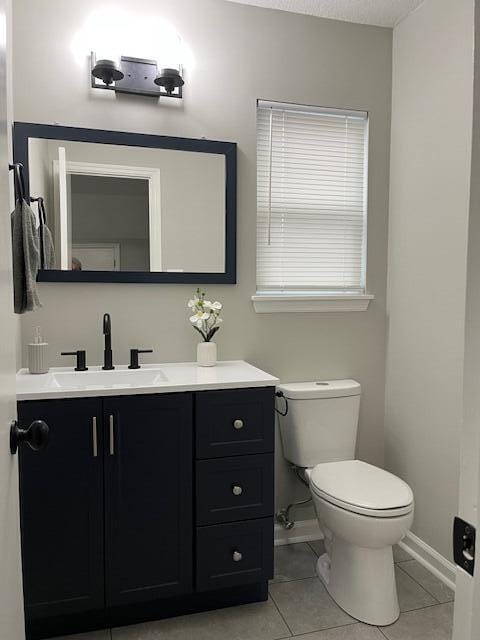 141 Glenora Dr, Martinez, GA 30907 - half bath featuring tile patterned floors, toilet, vanity, and baseboards