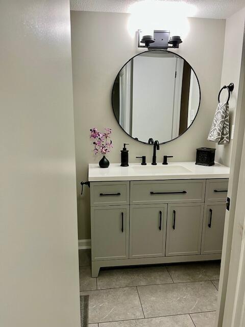 141 Glenora Dr, Martinez, GA 30907 - bathroom with tile patterned flooring, vanity, and a textured ceiling