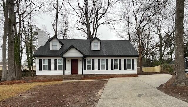 141 Glenora Dr, Martinez, GA 30907 - cape cod house featuring a chimney and concrete driveway