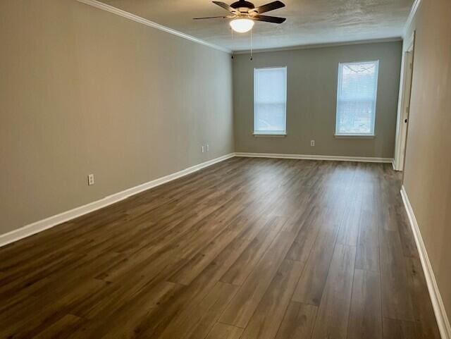 141 Glenora Dr, Martinez, GA 30907 - spare room featuring dark wood-type flooring, ceiling fan, baseboards, and ornamental molding