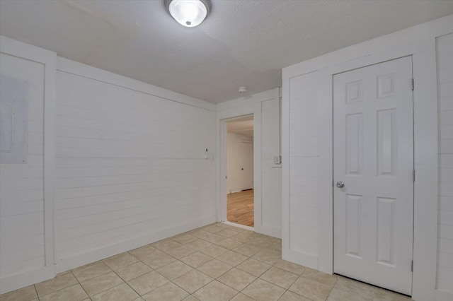 empty room with light tile patterned floors