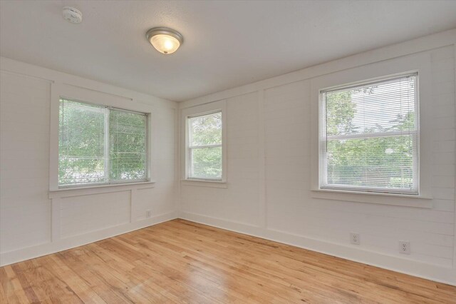 empty room featuring wood-type flooring