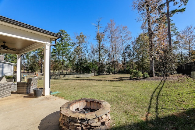 view of yard with a patio area, ceiling fan, and a fire pit