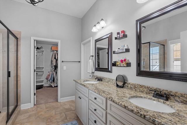 bathroom featuring walk in shower and vanity