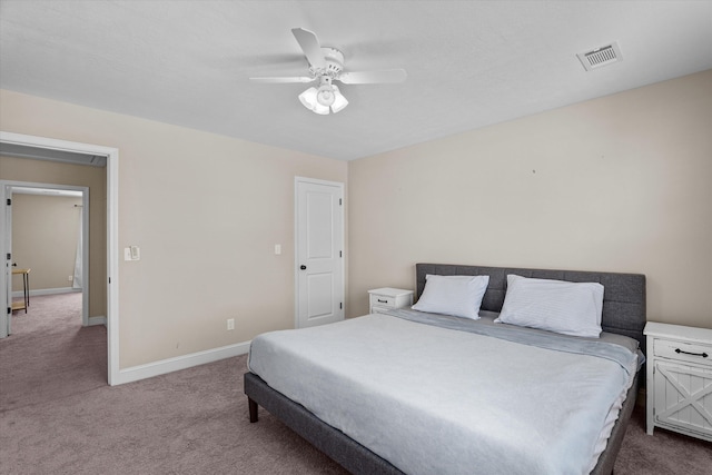 bedroom with ceiling fan and carpet