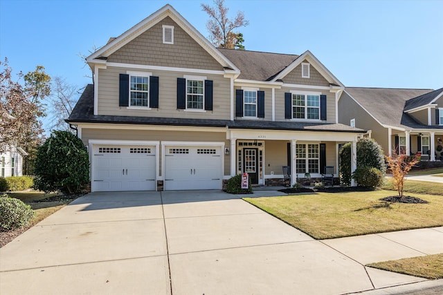 craftsman-style house with a garage, a front yard, and a porch