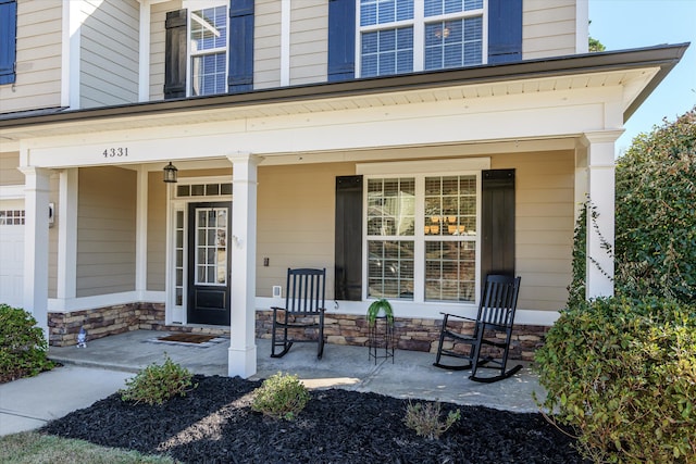 doorway to property featuring a porch