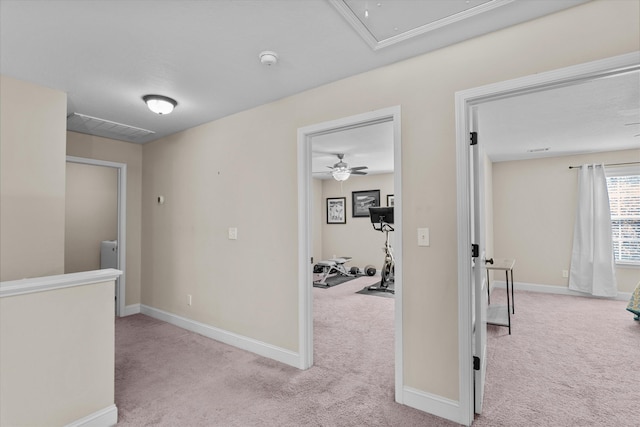 hallway with light colored carpet