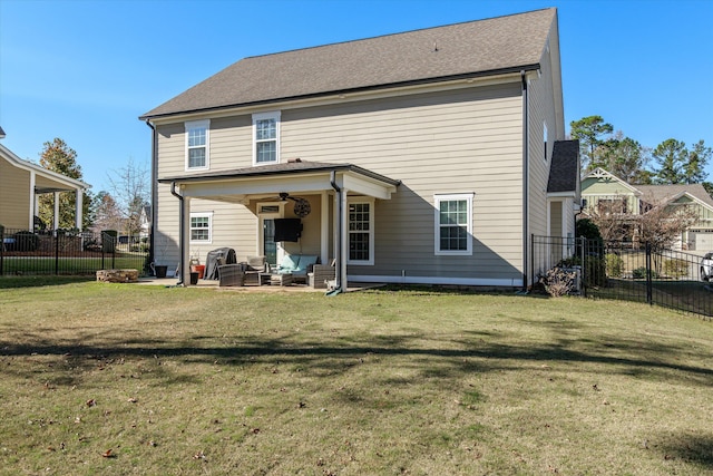 rear view of property with a patio area and a lawn