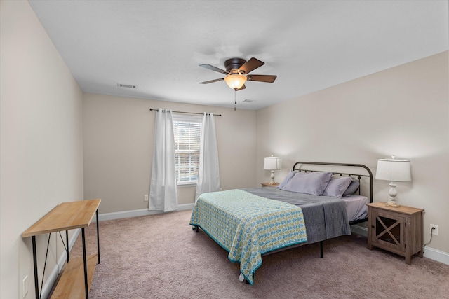 bedroom with light colored carpet and ceiling fan