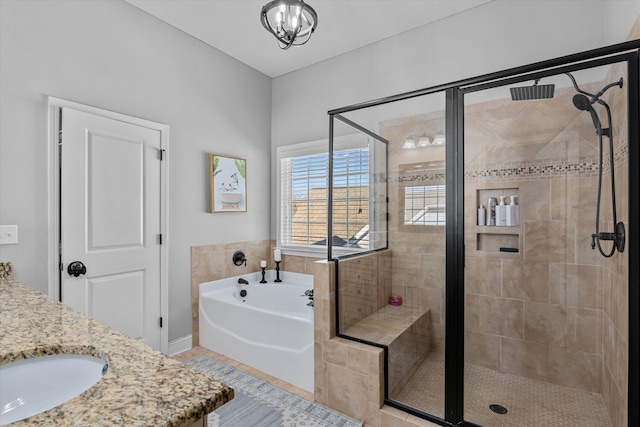 bathroom with tile patterned floors, vanity, and plus walk in shower