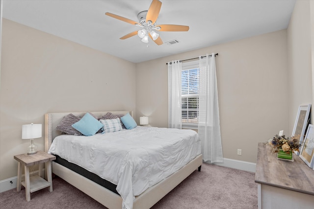 bedroom with light colored carpet and ceiling fan