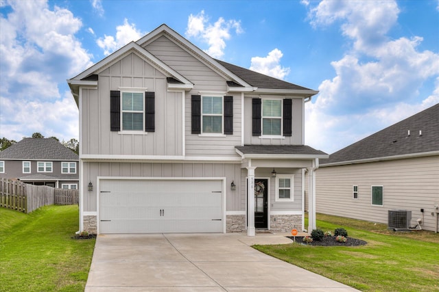 craftsman house with board and batten siding, fence, cooling unit, a front lawn, and stone siding