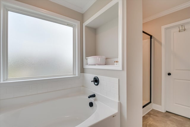 full bathroom with a garden tub, ornamental molding, and a stall shower