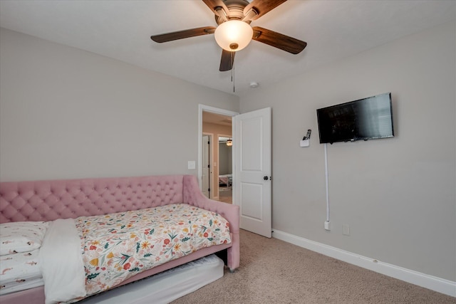 bedroom with baseboards, carpet, and a ceiling fan